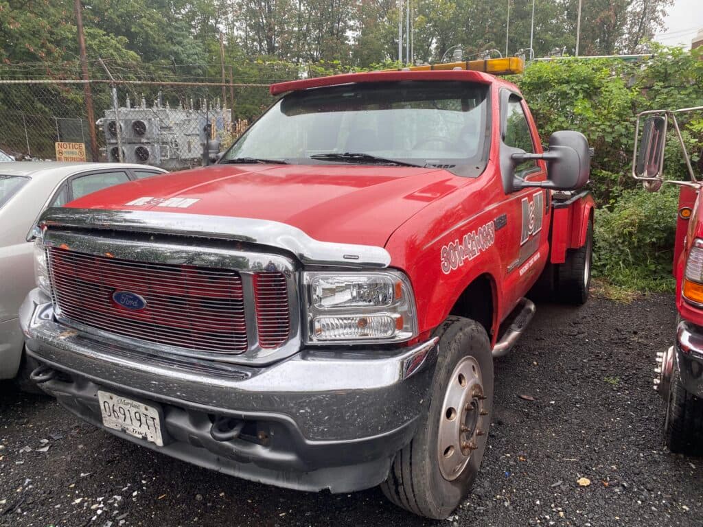 A&M Repair & Towing red Ford tow truck