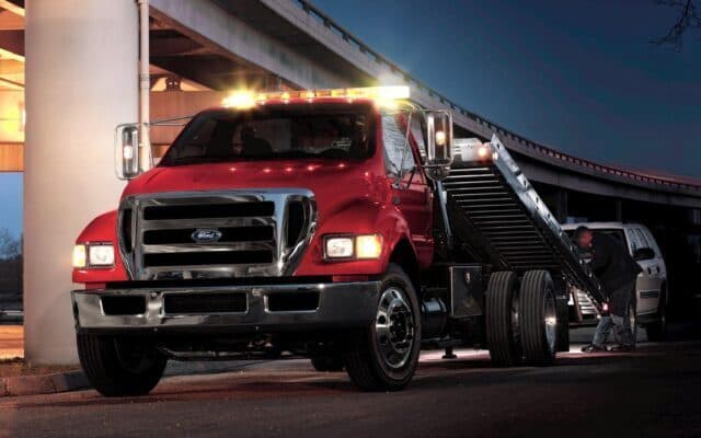 Flatbed tow truck ready for a night-time recovery call